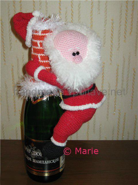 knitted santa on a bottle of champagne